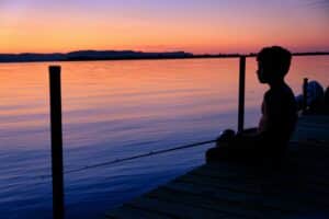sitting on dock during sunset